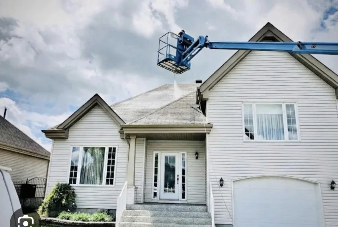 Residential roof project with lift equipment at the home